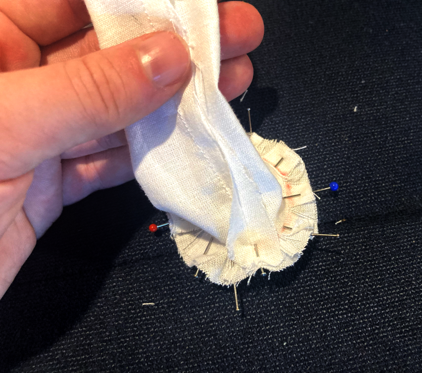 Pin the feet to the ends of the legs